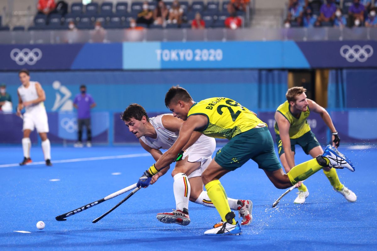 TOKYO, JAPAN - AUGUST 05: Arthur Van Doren of Team Belgium and Tim Brand of Team Australia battle for the ball during the Men's Gold Medal match between Australia and Belgium on day thirteen of the Tokyo 2020 Olympic Games at Oi Hockey Stadium on August 05, 2021 in Tokyo, Japan. (Photo by Alexander Hassenstein/Getty Images)